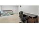 Bedroom featuring a wooden desk and office chair and a daybed at 4014 S Kirk Way, Aurora, CO 80013