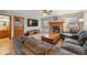 Comfortable living room features a fireplace, TV, and neutral color scheme at 4014 S Kirk Way, Aurora, CO 80013