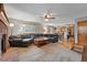 Spacious living room with an open floor plan, a fireplace, and access to the kitchen at 4014 S Kirk Way, Aurora, CO 80013