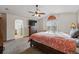 Inviting main bedroom with ensuite bathroom, large dresser, and vaulted ceilings at 4014 S Kirk Way, Aurora, CO 80013