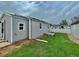 Backyard features lush green grass, grey siding, and a freshly laid yard at 98 N 12Th Ave, Brighton, CO 80601