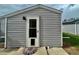 Back entrance with a dog door and stylish mat at 98 N 12Th Ave, Brighton, CO 80601