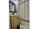 Bathroom features a light wood vanity and mirror over the sink, and a shower at 98 N 12Th Ave, Brighton, CO 80601