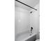 Bright bathroom featuring a white tiled shower with black fixtures at 98 N 12Th Ave, Brighton, CO 80601