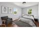 Bright bedroom featuring hardwood floors, ample sunlight, and cozy decor at 98 N 12Th Ave, Brighton, CO 80601
