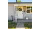 Inviting front door with decorative wreath and charming porch, showing curb appeal at 98 N 12Th Ave, Brighton, CO 80601