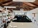 Spacious garage interior featuring ample lighting, storage shelves, and convenient garage door at 98 N 12Th Ave, Brighton, CO 80601