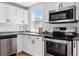 This kitchen features a stainless steel oven, microwave, dishwasher and granite counter tops at 98 N 12Th Ave, Brighton, CO 80601
