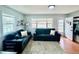 Well-lit living room with plush sofas and hardwood floors, offering a cozy and inviting atmosphere at 98 N 12Th Ave, Brighton, CO 80601