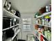 This walk-in pantry offers ample storage space with rows of shelving to keep everything organized and accessible at 98 N 12Th Ave, Brighton, CO 80601