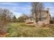 Landscaped backyard features a stone patio and a lush lawn, creating a peaceful outdoor retreat at 8441 Timberwood St, Littleton, CO 80126