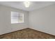 Bedroom featuring neutral walls and carpet with a window at 8441 Timberwood St, Littleton, CO 80126