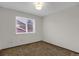 Bedroom featuring neutral walls and carpet with a window at 8441 Timberwood St, Littleton, CO 80126