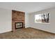 Living room features fireplace and plush carpet at 8441 Timberwood St, Littleton, CO 80126