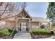 Community amenity building featuring a gated entrance, pergola, and well-maintained landscaping at 6220 Salvia St, Arvada, CO 80403
