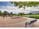 Community playground featuring swings, slides, and climbing structures, with a scenic mountain backdrop at 6220 Salvia St, Arvada, CO 80403