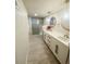 Modern basement bathroom boasts double sinks, updated cabinets and a stylish glass shower at 3000 Billings St, Aurora, CO 80011