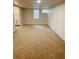 Finished basement bedroom with carpet and a window as well as closet and bathroom access at 3000 Billings St, Aurora, CO 80011