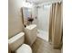 Bathroom with marble tiled shower, modern vanity, and updated fixtures at 3000 Billings St, Aurora, CO 80011