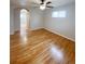 Bedroom featuring hardwood floors, ceiling fan, and natural light at 3000 Billings St, Aurora, CO 80011