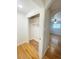 Walk-in closet with hardwood floors and built-in shelving at 3000 Billings St, Aurora, CO 80011