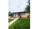 Cozy brick home with covered entry and lush green lawn at 3000 Billings St, Aurora, CO 80011