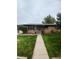 Charming brick home with well-maintained front yard and covered entry at 3000 Billings St, Aurora, CO 80011
