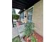 Cozy front porch featuring a brick house and manicured landscaping at 3000 Billings St, Aurora, CO 80011