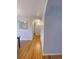 Hallway with hardwood floors and neutral wall paint at 3000 Billings St, Aurora, CO 80011