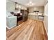 Updated kitchen with stainless steel appliances, lots of cabinets, and wood look flooring at 3000 Billings St, Aurora, CO 80011