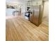 Open kitchen and dining area featuring stainless steel appliances and wood flooring at 3000 Billings St, Aurora, CO 80011