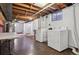 Unfinished basement with laundry area featuring washer, dryer, a utilitarian toilet, and space for storage at 2813 S Zenobia St, Denver, CO 80236