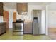 This kitchen features stainless steel appliances and a refrigerator with water and ice dispenser at 2813 S Zenobia St, Denver, CO 80236