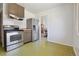 Kitchen with stainless steel appliances and white tiled backsplash at 2813 S Zenobia St, Denver, CO 80236