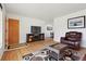 Cozy living room with hardwood floors and white walls, perfect for relaxing and entertaining at 2813 S Zenobia St, Denver, CO 80236