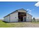 Large barn structure with open access, ideal for agricultural or storage purposes at 30999 Kootney St, Elizabeth, CO 80107