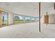 Spacious basement with large windows offering scenic outdoor views and carpeted flooring at 30999 Kootney St, Elizabeth, CO 80107