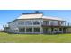 Spacious two-story home with multiple decks, surrounded by green fields, providing a tranquil setting at 30999 Kootney St, Elizabeth, CO 80107