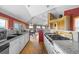 Bright kitchen and open-concept living space boasting white cabinets, granite countertops, and scenic views at 30999 Kootney St, Elizabeth, CO 80107