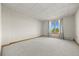 Carpeted room featuring a window with a scenic view and neutral walls at 30999 Kootney St, Elizabeth, CO 80107