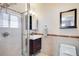 Modern bathroom featuring a glass-enclosed shower and decorative tile at 6445 Second St, Louviers, CO 80131