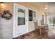 Inviting front porch featuring rocking chairs and a welcoming entrance decor at 6445 Second St, Louviers, CO 80131