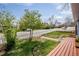 Landscaped front yard and partial porch, showcasing the home's curb appeal at 6445 Second St, Louviers, CO 80131