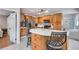 Open kitchen with island, stainless appliances, and lots of cabinet space at 6445 Second St, Louviers, CO 80131