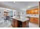Bright kitchen boasts a kitchen island, recessed lighting and breakfast bar at 6445 Second St, Louviers, CO 80131