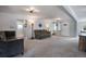 Spacious living room with neutral paint, plush carpeting, and lots of light at 6445 Second St, Louviers, CO 80131