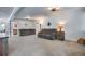 Bright living room features plush carpeting, shiplap walls, and neutral colors at 6445 Second St, Louviers, CO 80131