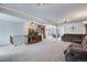Spacious living room with a stone fireplace, perfect for relaxation and entertaining at 6445 Second St, Louviers, CO 80131