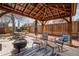 Outdoor patio with covered pergola, creating a comfortable entertaining space at 6445 Second St, Louviers, CO 80131