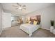 Bedroom with a ceiling fan, a large window, a painting on the wall, and a mirrored closet at 23612 Pondview Pl # A, Golden, CO 80401